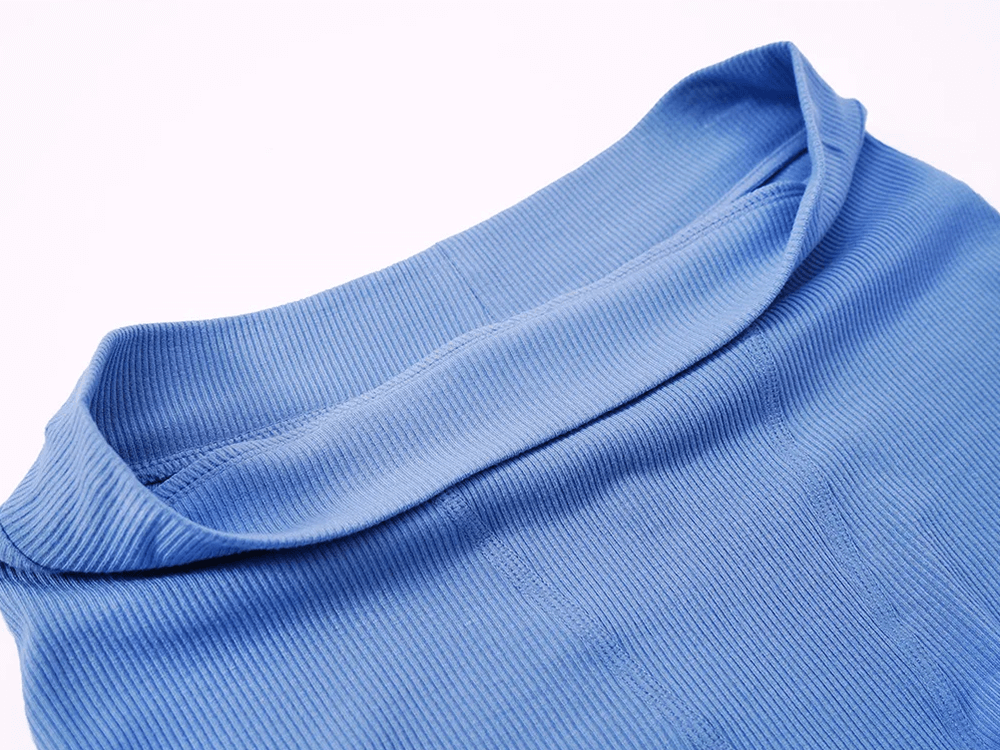 Close-up of blue yoga and fitness shorts waistband, showing soft stretchy ribbed fabric for comfort during workouts.